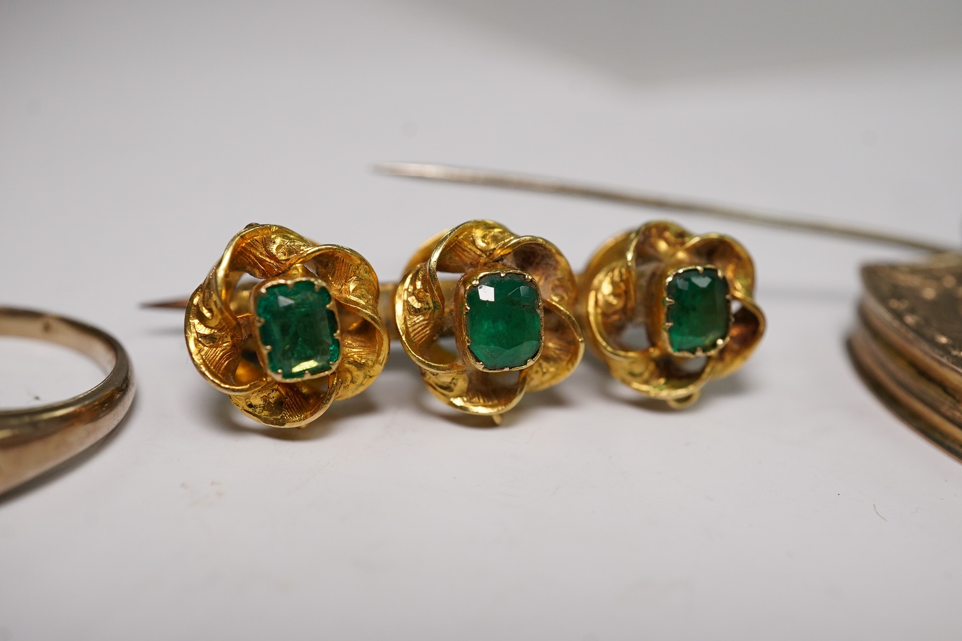 A small group of assorted jewellery including a coral necklace, 9c compass fob, five yellow metal items including a ring, locket and brooch and a stick pin. Condition - poor to fair